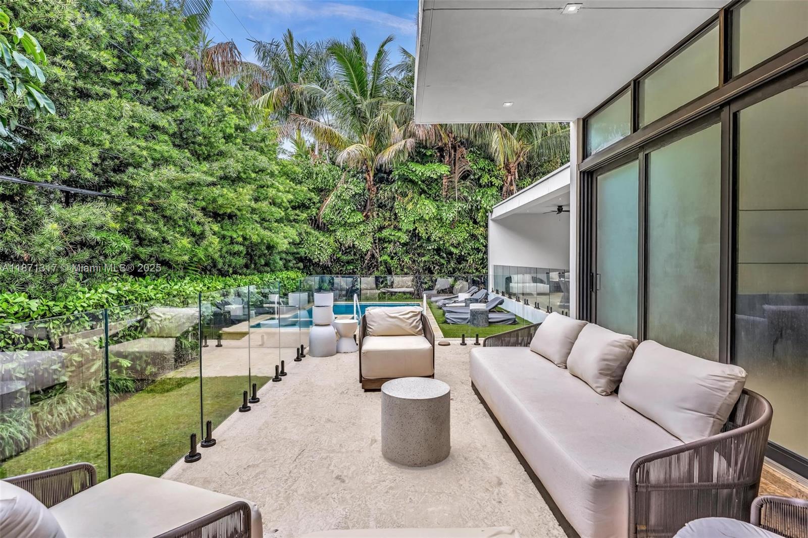 1350 98th Street Bay Harbor Islands, FL 33154 - Photo 35 of 46 a view of a patio with couches chairs and a potted plant