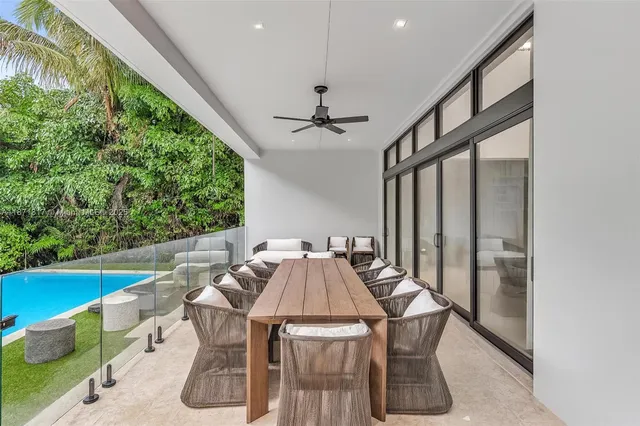 a view of a backyard with sitting area and slide