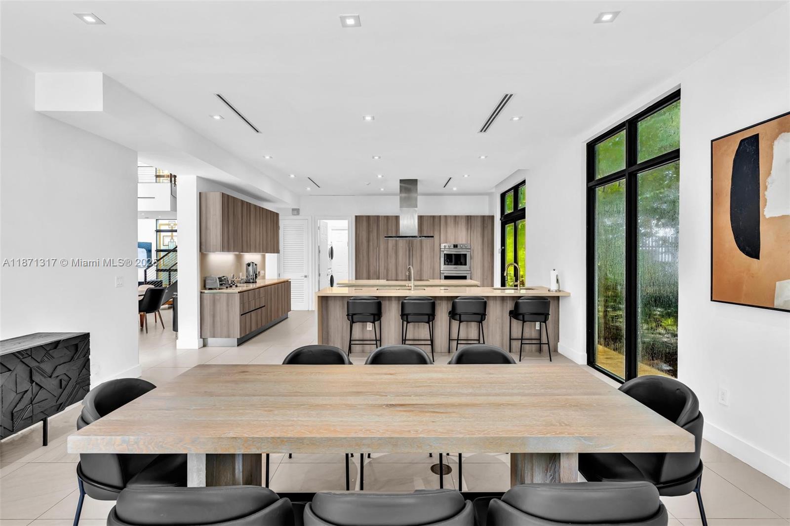 1350 98th Street Bay Harbor Islands, FL 33154 - Photo 5 of 46 a view of a dining room with furniture window and wooden floor