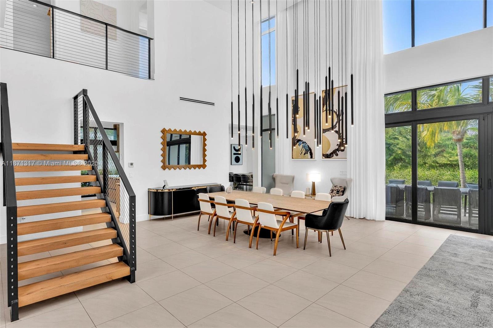 1350 98th Street Bay Harbor Islands, FL 33154 - Photo 9 of 46 a dining room with furniture and a large window
