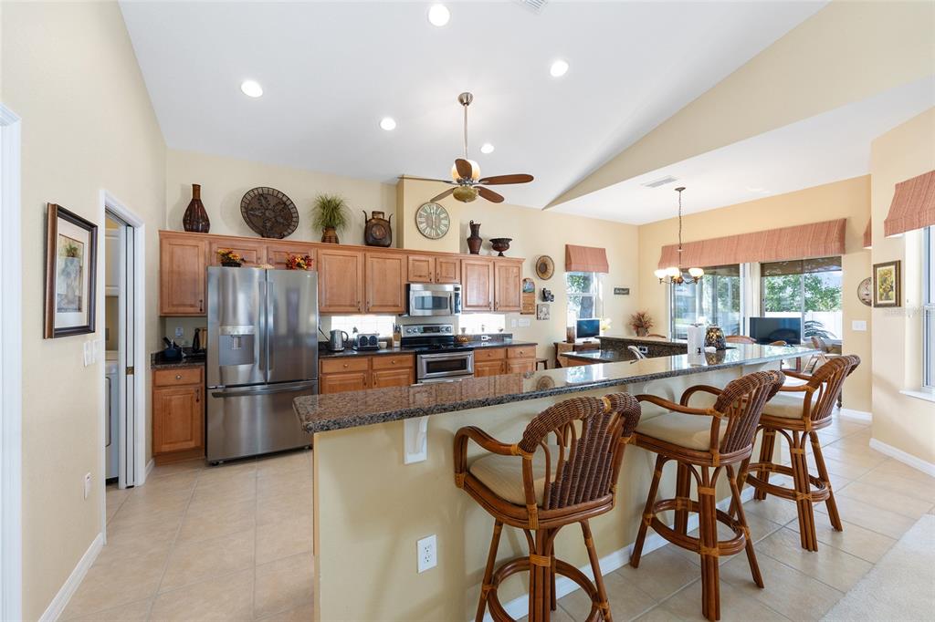 10751 Southwest 71st Circle Ocala, FL 34476 - Photo 35 of 52 a large kitchen with a table and chairs