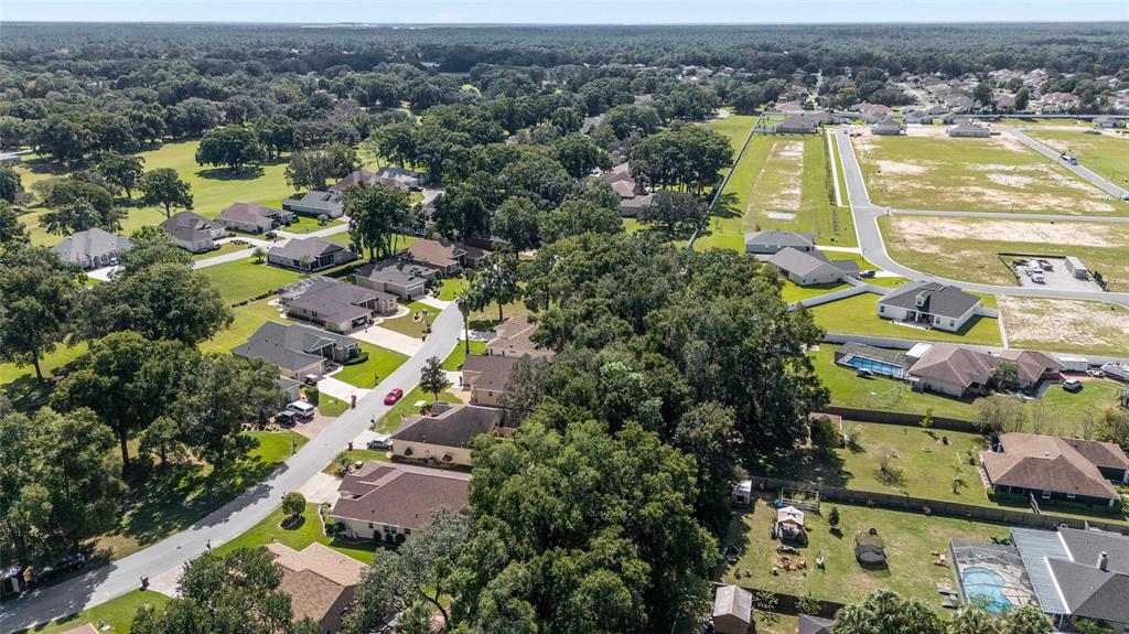 10751 Southwest 71st Circle Ocala, FL 34476 - Photo 38 of 52 an aerial view of residential houses with outdoor space and swimming pool