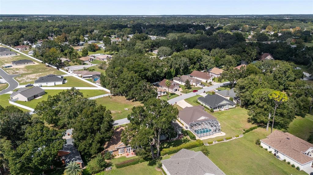 10751 Southwest 71st Circle Ocala, FL 34476 - Photo 49 of 52 an aerial view of residential houses with outdoor space