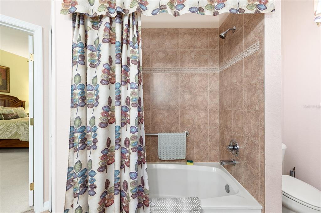 10751 Southwest 71st Circle Ocala, FL 34476 - Photo 7 of 52 a bathroom with a bathtub and shower