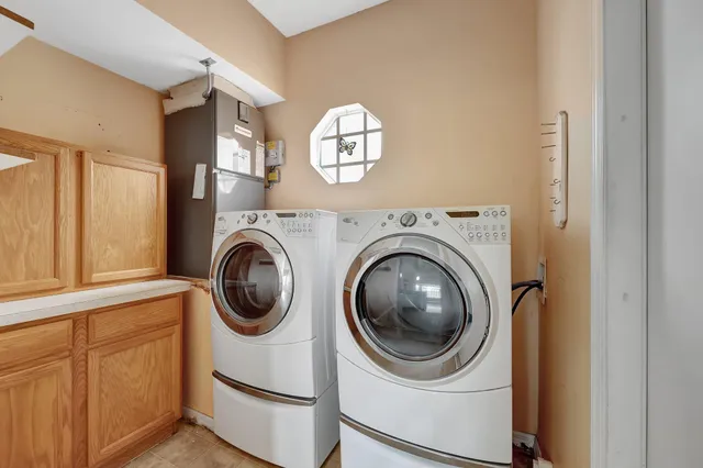 a view of a hallway with washer and dryer