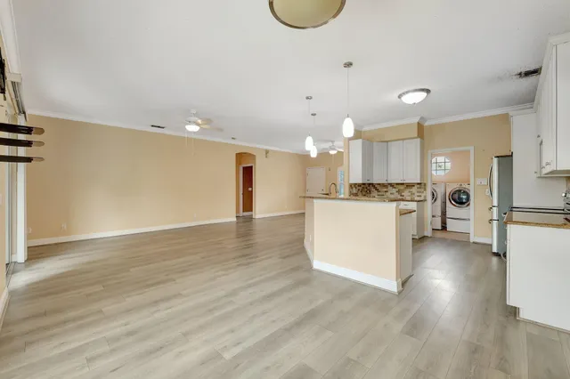 a view of kitchen with wooden floor