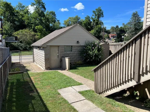 a front view of a house with yard