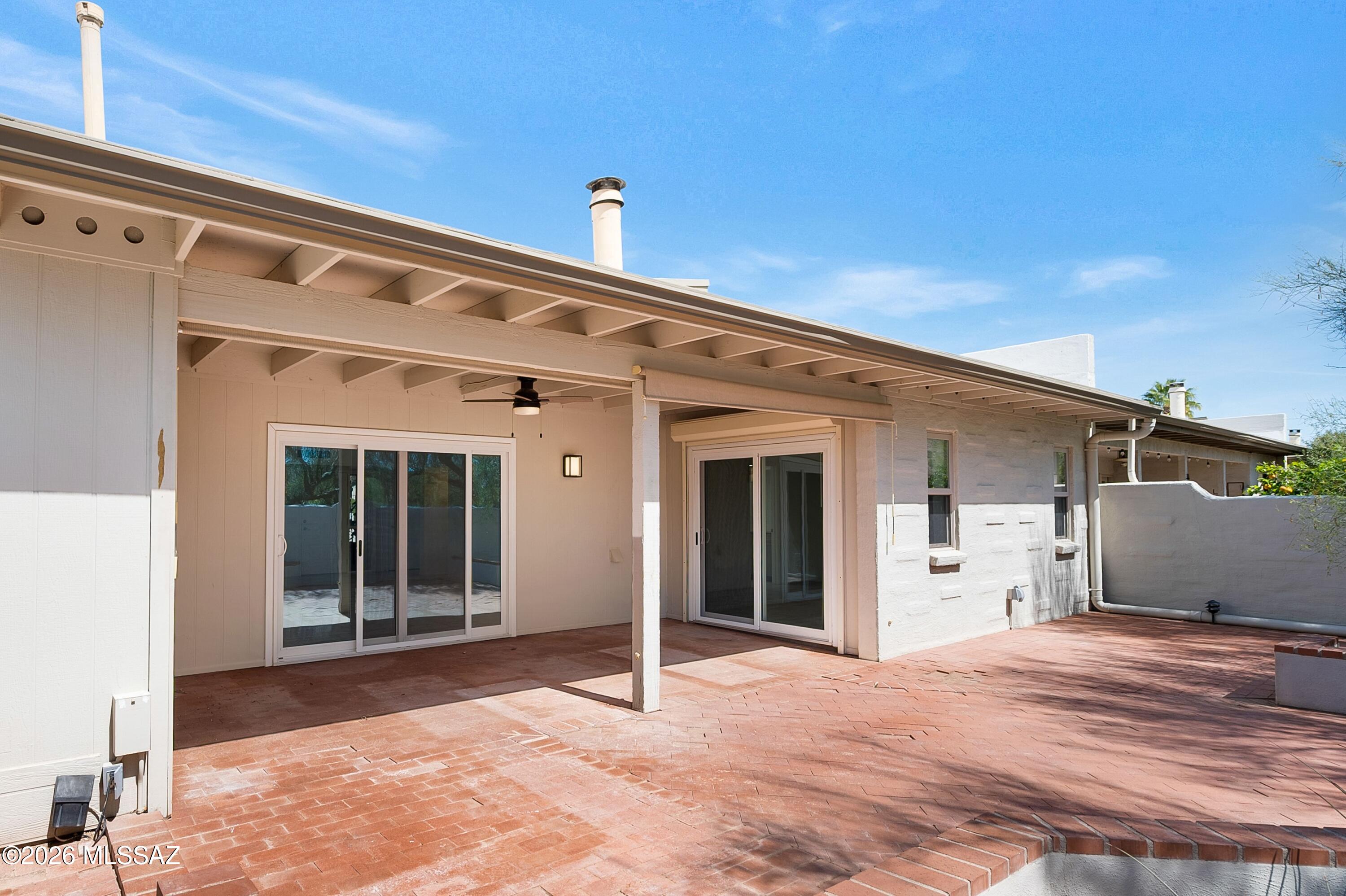 7408 East Wandering Road Tucson, AZ 85750 - Photo 23 of 25 a view of a house with a wooden deck