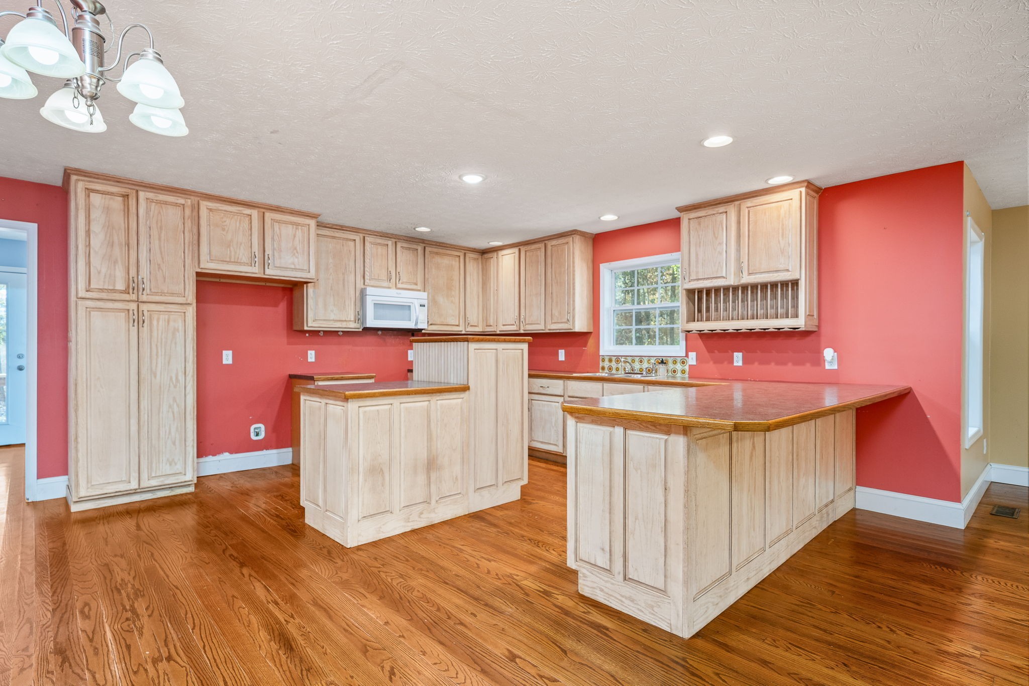 375 Golden Herren Road Sparta, TN 38583 - Photo 24 of 45 a kitchen with kitchen island granite countertop wooden floors and a sink