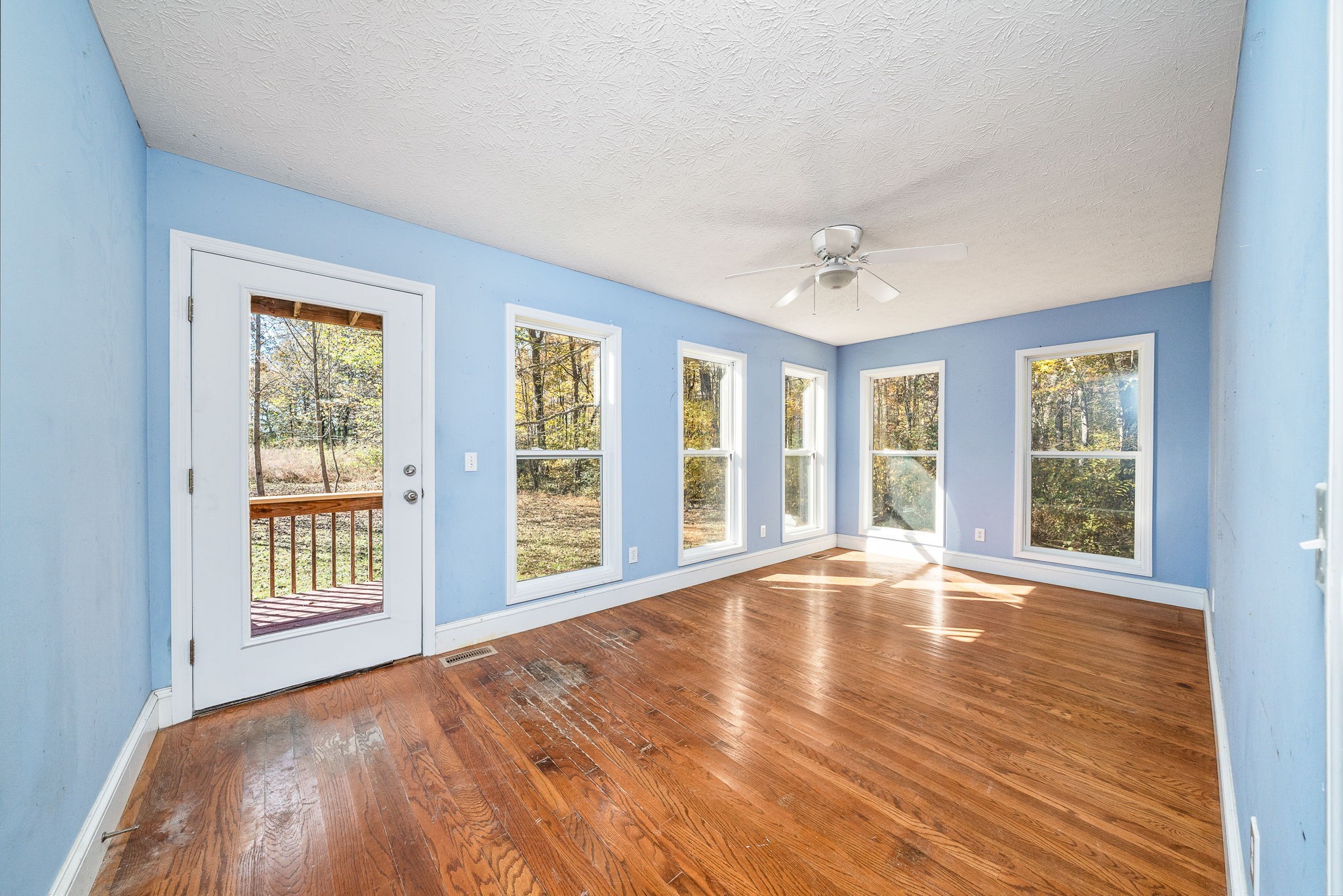 375 Golden Herren Road Sparta, TN 38583 - Photo 29 of 45 a view of an empty room with a window and wooden floor