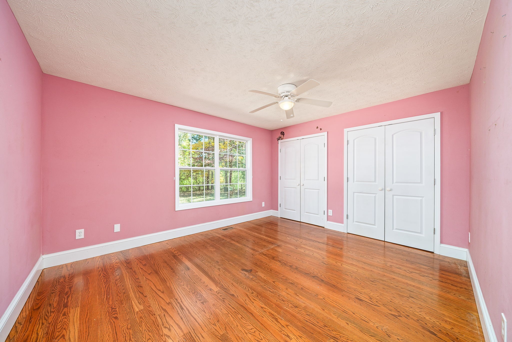 375 Golden Herren Road Sparta, TN 38583 - Photo 39 of 45 a view of an empty room with a window and wooden floor