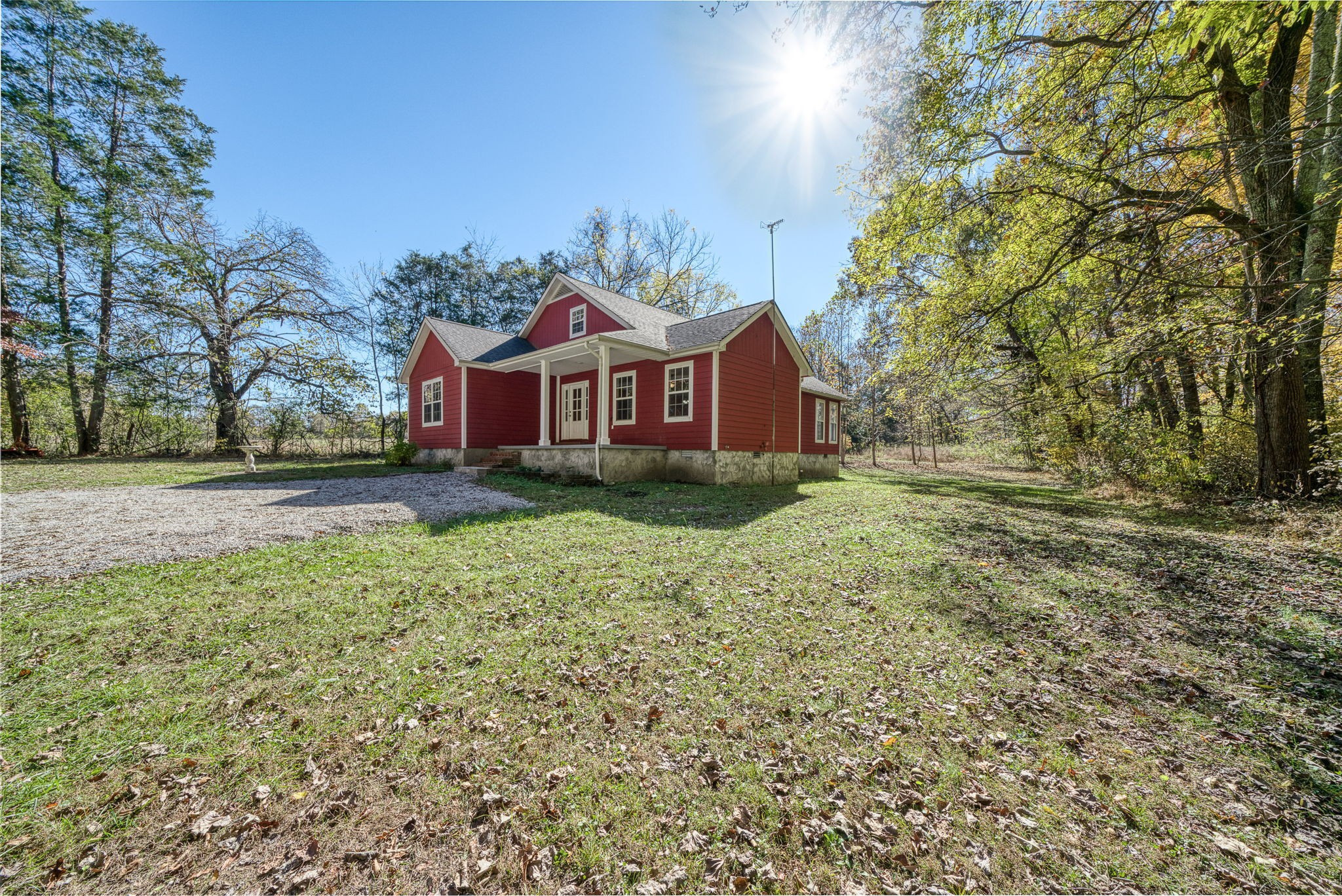 375 Golden Herren Road Sparta, TN 38583 - Photo 10 of 45 a front view of a house with a yard and large trees
