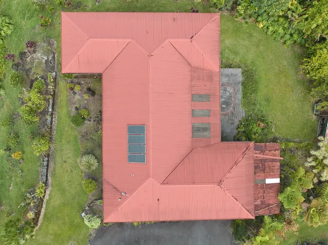 an outdoor space with plants and pool
