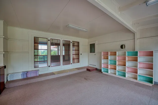 a view of an empty room with a balcony