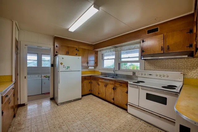 a kitchen that has a sink and a stove