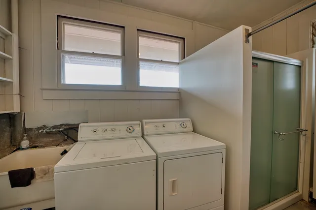 a utility room with dryer and washer