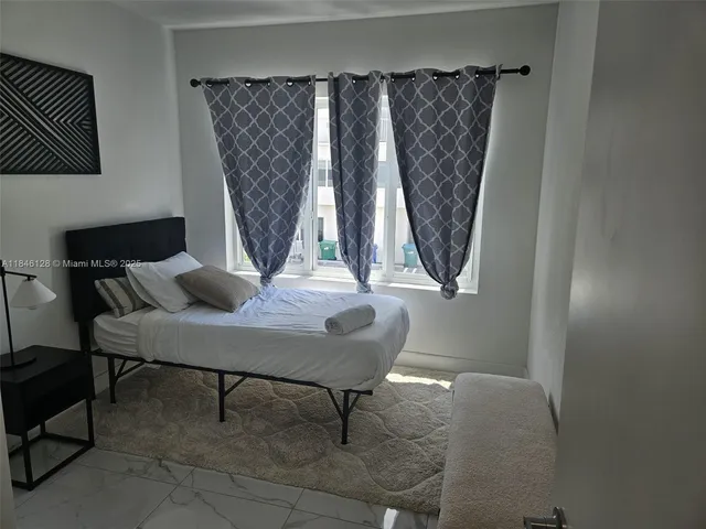 a view of a livingroom with furniture and window