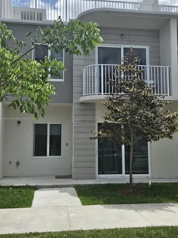 a house view with a garden space