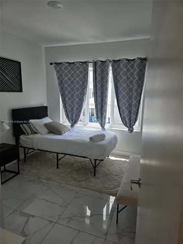 a living room with a rug