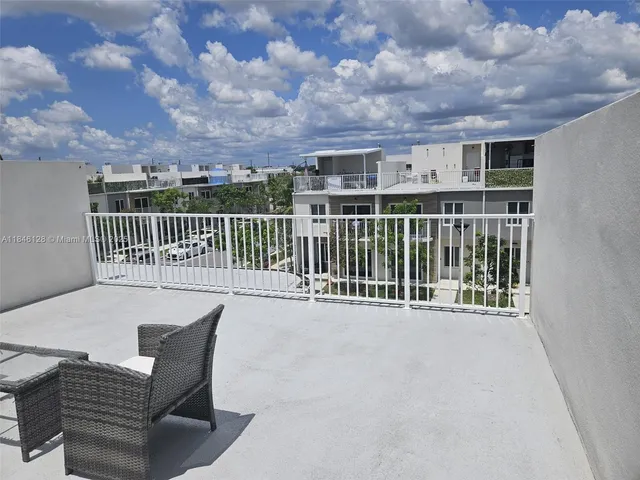 a view of a chairs and table in the terrace
