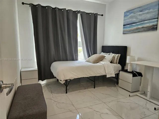 a bedroom with furniture and a toilet