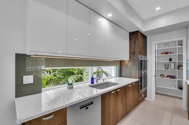 a kitchen with a cabinets and wooden floor