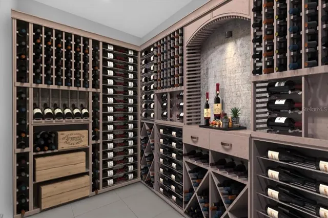 a kitchen with a center island wooden floor cabinets and stainless steel appliances