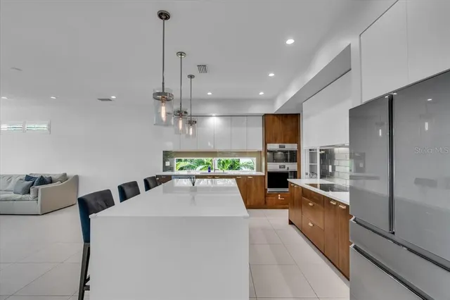 a kitchen with a table and chairs in it