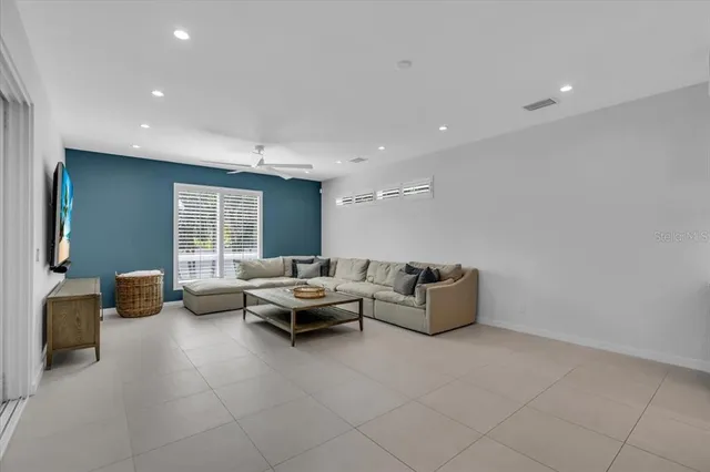 a bathroom with a sink toilet double vanity and shower