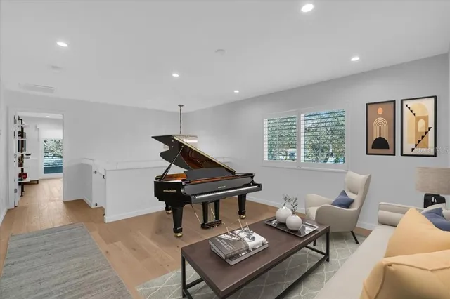 a spacious bedroom with a large bed and a window