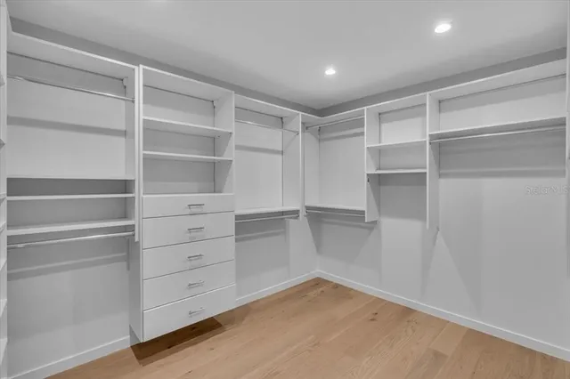 a living room with a couch and a large window