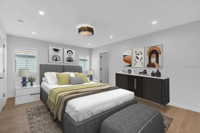 a bedroom with a bed and window