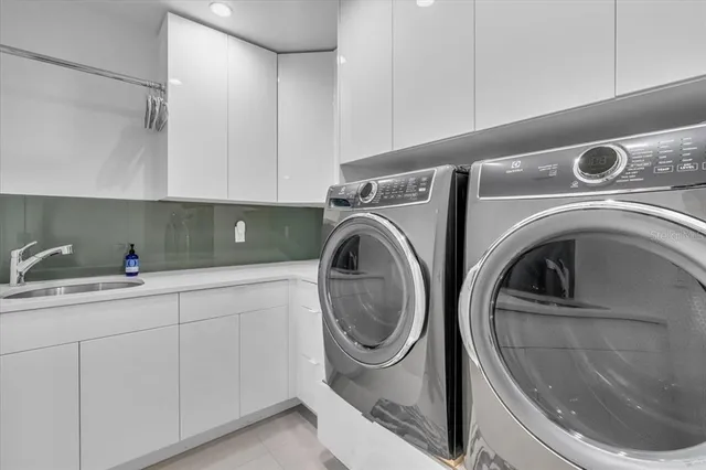 a view of a garden with plants and a bench