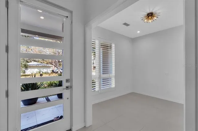 a view of entryway and hall with wooden floor