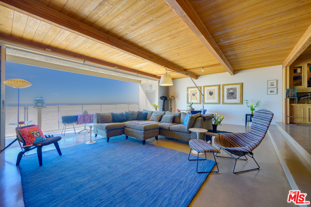1 Spinnaker Street, Unit 2 Marina del Rey, CA 90292 - Photo 5 of 33 a living room with furniture a wooden floor and a table