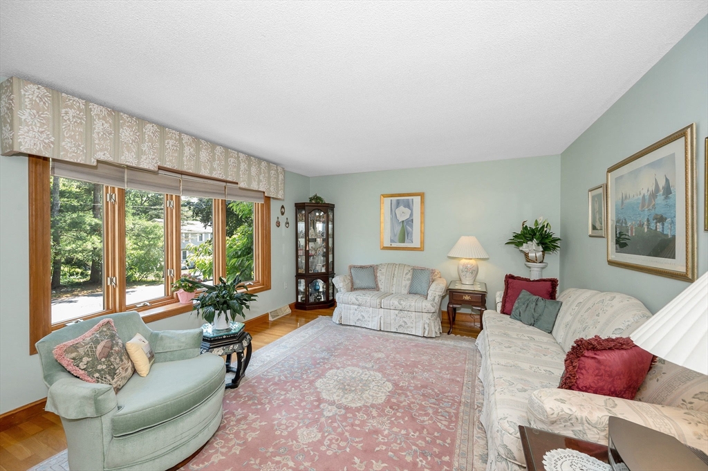 73 Partridge Road Billerica, MA 01821 - Photo 4 of 37 a living room with furniture and a large window