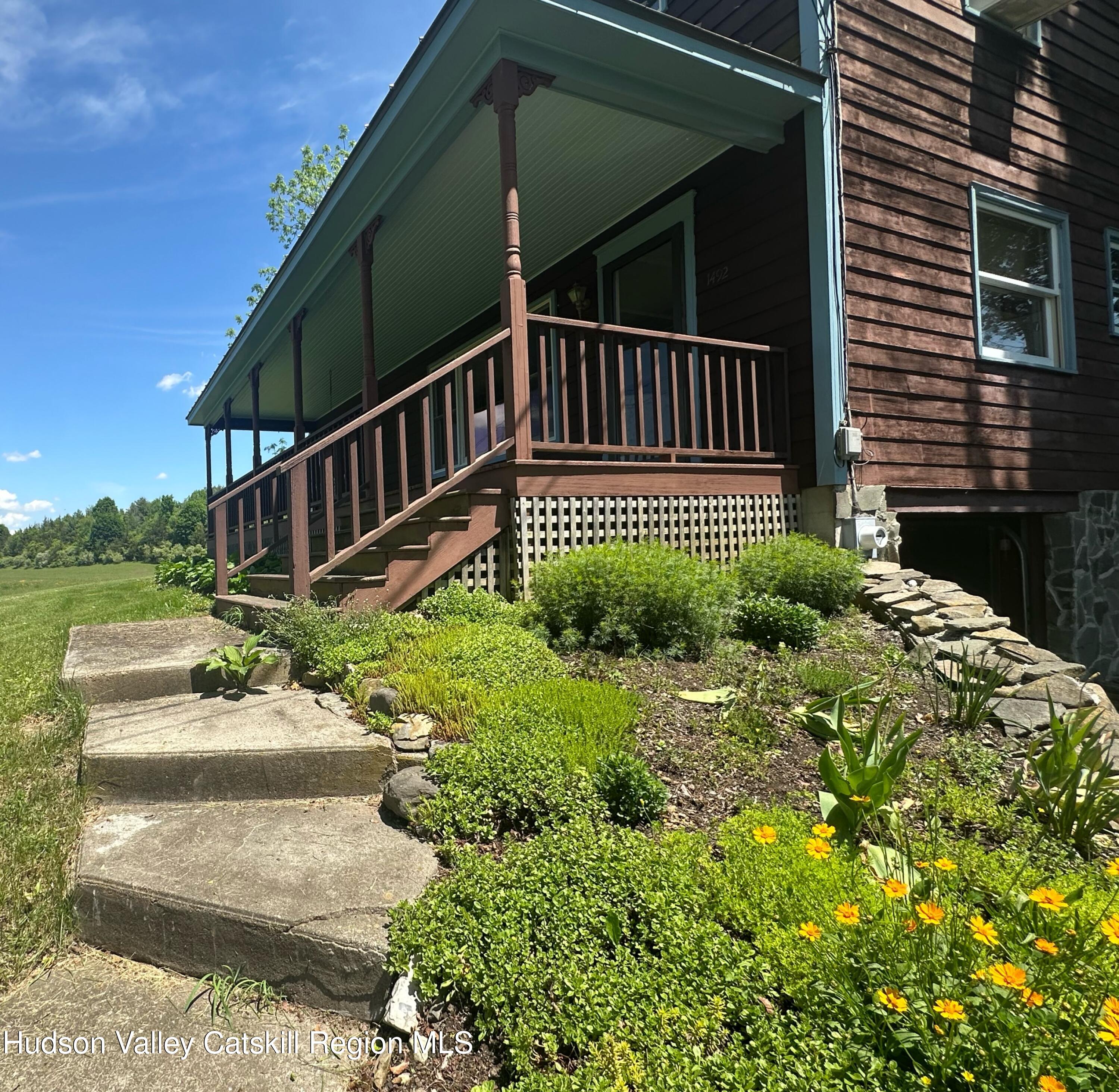 1492 County Road Copake, NY 12516 - Photo 21 of 34 a view of a garden with a deck