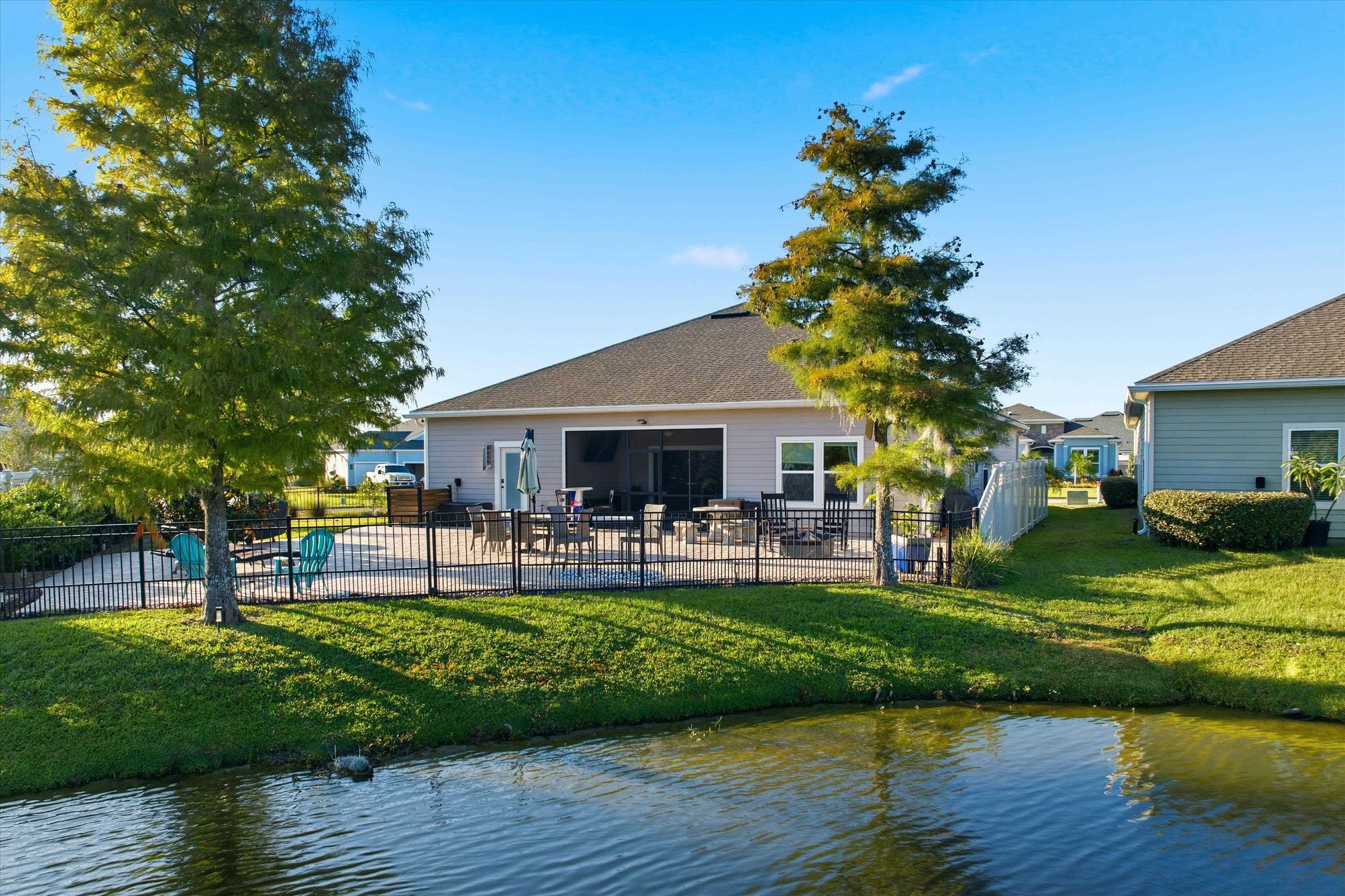 20 Trumpco Drive St. Augustine, FL 32092 - Photo 33 of 45 a front view of a house with garden and sitting area
