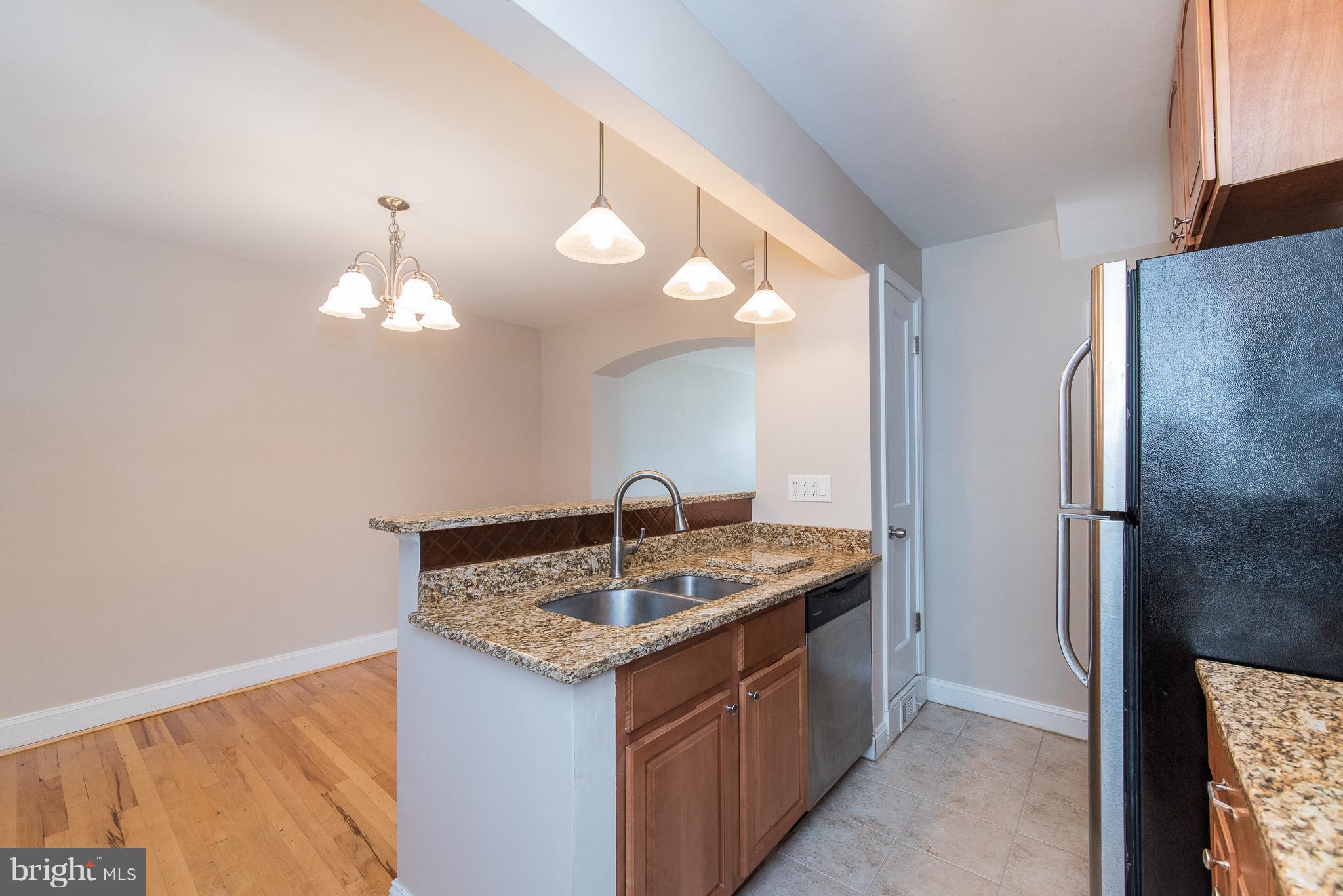 3472 Dunhaven Road Baltimore, MD 21222 - Photo 14 of 30 a bathroom with a granite countertop sink a large mirror and a shower