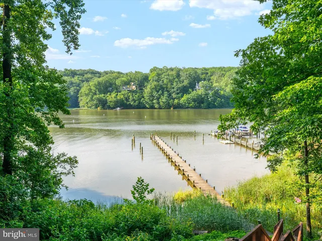 a living room with furniture a table and a large window