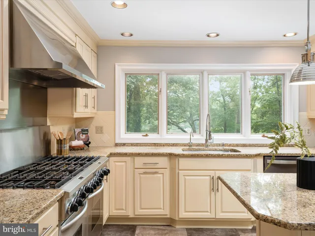 a spacious bedroom with a bed a couch and dresser