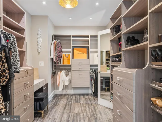 an aerial view of a house with a yard and large trees