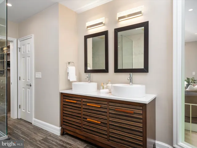 a front view of a house with a yard and a street