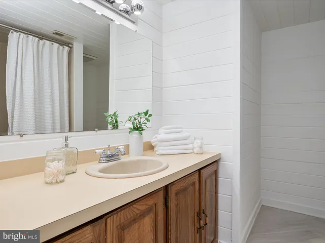 a front view of a house with a yard table and chairs