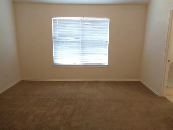 a white bath tub sitting next to a window
