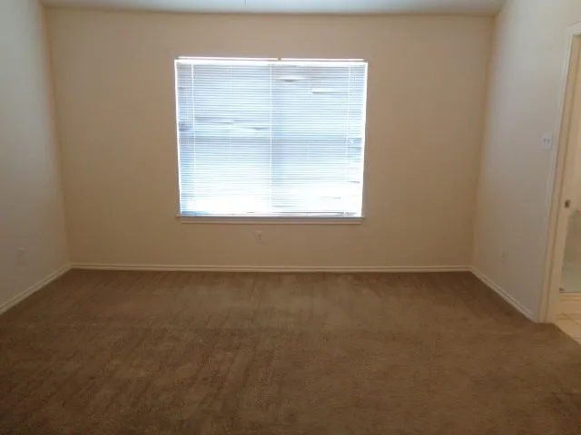 a white bath tub sitting next to a window