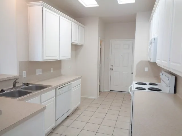 an empty room with a empty space and a ceiling fan