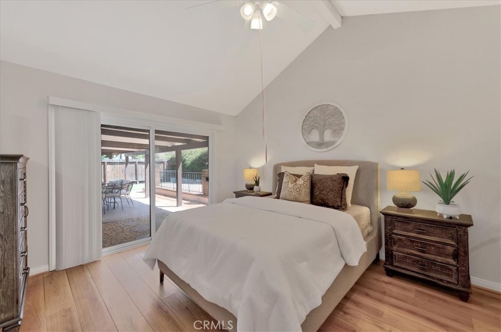 23772 Cll Hogar Mission Viejo, CA 92691 - Photo 19 of 30 a bedroom with a bed and wooden floor