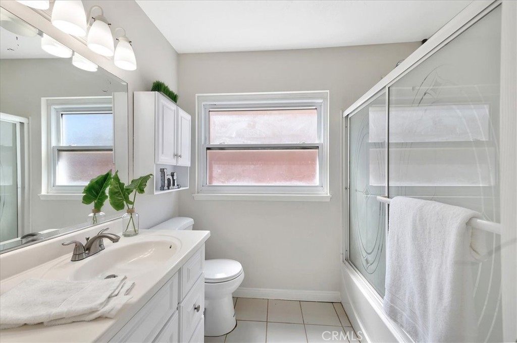 23772 Cll Hogar Mission Viejo, CA 92691 - Photo 22 of 30 a bathroom with a granite countertop sink toilet and shower