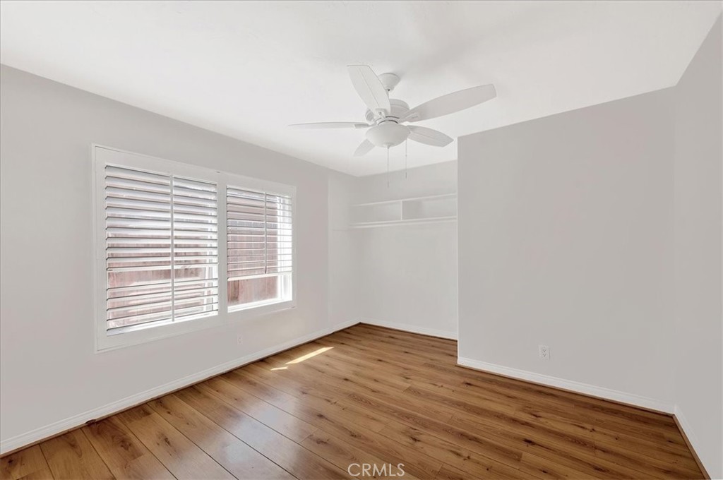23772 Cll Hogar Mission Viejo, CA 92691 - Photo 23 of 30 an empty room with wooden floor and windows